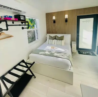 a bedroom with a bed and a window at Guesthouse w Bikes near Wynwood in Miami