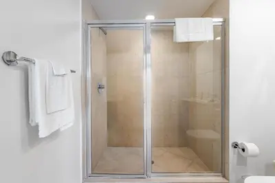 a shower with a glass door in a bathroom at ICON Brickell Miami- 2 bedroom Condo with City and water views! in Miami