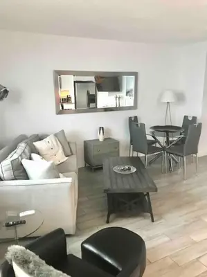 a living room with a couch and a table at Block from Beach one bedroom with Parking in Miami Beach
