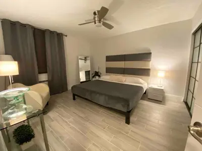 a bedroom with a bed and a ceiling fan at Block from Beach one bedroom with Parking in Miami Beach