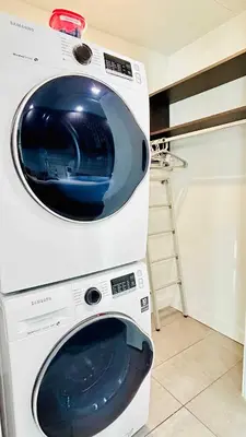 a white washing machine with its door open in a kitchen at Sky-High oasis Large Studio POOL & GYM in Miami