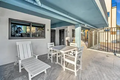 a patio with a table and chairs on a balcony at Beachfront & Pool Near Marriott Hollywood Beach in Hollywood