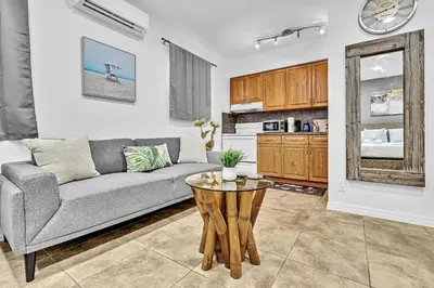a living room with a couch and a table at Beachfront & Pool Access Unit W 2 Queen Beds in Hollywood