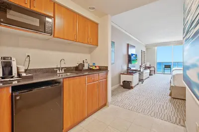 a kitchen with a sink and a microwave at Trump International Beach Resort Deluxe 2 Queen Ocean Front in Sunny Isles Beach