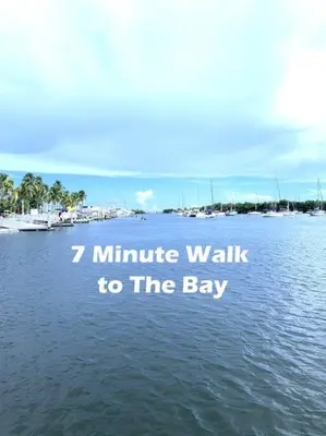 a large body of water with the words minute walk to the bay at GroveO4 10 min from the Beach in Miami