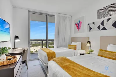 a hotel room with two beds and a window at Front Intercostal Luxury Apt View Amazing in Hollywood