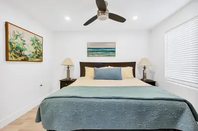 a bedroom with a bed and a ceiling fan at ULTRA Modern Apartment by the Beach in Hollywood
