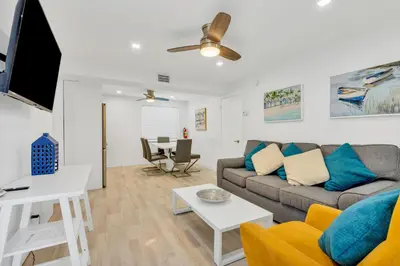 a living room with a couch and a table at ULTRA joyful apartment perfect for families in Hollywood