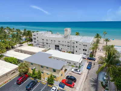 an aerial view of a building with the beach at ULTRA exciting apartment at the Boardwalk in Hollywood