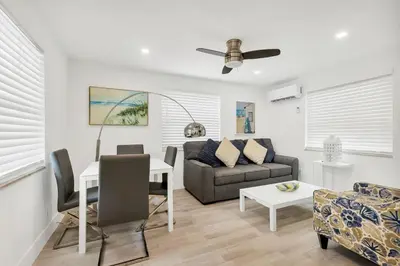 a living room with a couch and a table at ULTRA exciting apartment at the Boardwalk in Hollywood