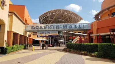 a shopping center with a sign for a donut shop at LaBella Suite in Miami