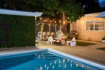a swimming pool in front of a house at Private Villa Miami Pool Oasis in Miami