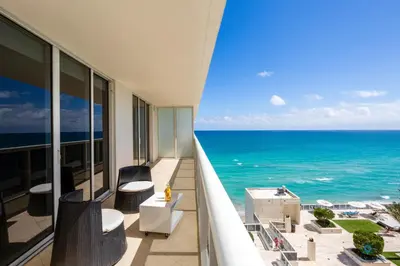 a balcony with a view of the ocean at Luxury High Resort Beautiful Views & Amenities in Hallandale Beach