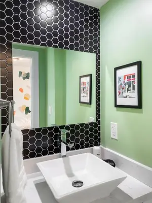 a bathroom with a sink and a mirror at Villa Palma - Prime Location, Pool, Game Room, Outdoor Kitchen in Miami