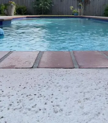 a swimming pool with bricks in the water at Pool House Resort heated swimming pool private duplex in Cutler Bay
