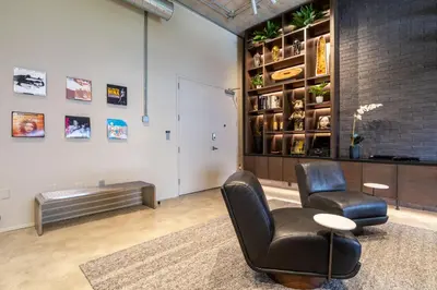 a living room with two chairs and a table at Wynwood Condo, Walk to Restaurants and Nightclubs! in Miami