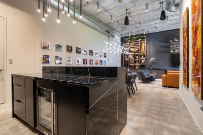 a bar in the middle of a room at Wynwood Condo, Walk to Restaurants and Nightclubs! in Miami