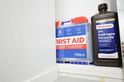 a shelf with a first aid kit and a fire extinguisher at GREAT Luxe House NEAR Downtown & Marina in Miami in Miami