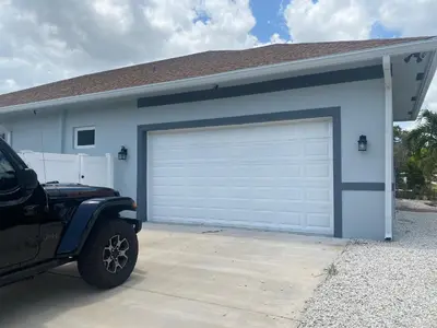 a car parked in front of a garage at Paradise Pool House in Dania in Dania Beach