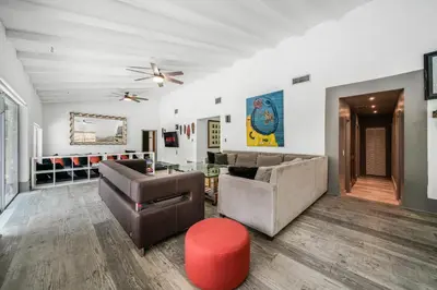 a living room with a couch and a table at New Villa Jungle Paradise Heated Pool BBQ Soccer in Miami