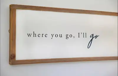 a wooden frame with a sign that reads where you go ill see at GroveO6 10 minutes from the Beach in Miami