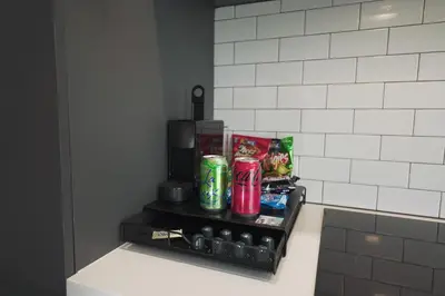 a shelf with drinks on it in a kitchen at NEW Luxury Downtown Apartment - Gym Pool Workspace in Miami