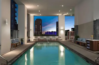 a swimming pool in a building with a view of a city at NEW Luxury Downtown Apartment - Gym Pool Workspace in Miami