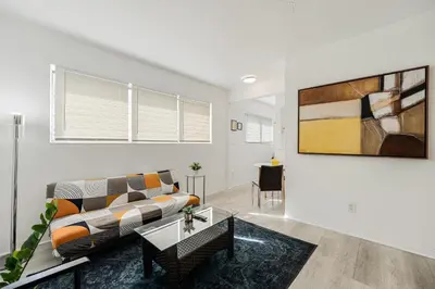 a living room with a couch and a table at Vibrant Little Havana Apt Near Brickell in Miami