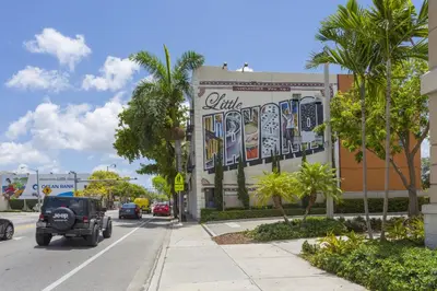 a building with a mural on the side of it at Vibrant Little Havana Apt Near Brickell in Miami