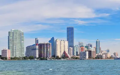a view of a city from the water with buildings at Vibrant Little Havana Apt Near Brickell in Miami