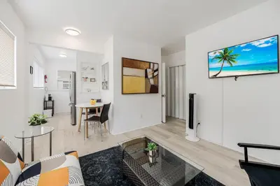 a living room with a couch and a table at Vibrant Little Havana Apt Near Brickell in Miami