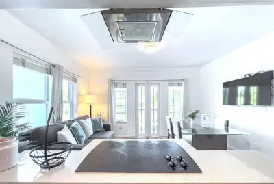a living room with a couch and a table at Ocean Drive apartment w Balcony Walk to the Beach in Miami Beach