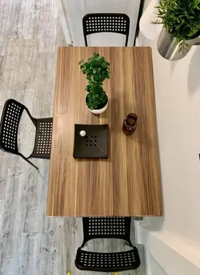 a wooden table with a clock and a plant on it at B02 5 min from beach studio Midtown Wynwood in Miami