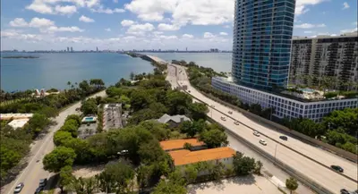 an aerial view of a city with a tall building at B02 5 min from beach studio Midtown Wynwood in Miami