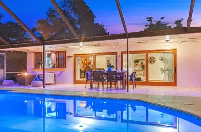 an image of a house with a swimming pool at Family Beach Home With Home Theater & Heated Pool! in Hollywood