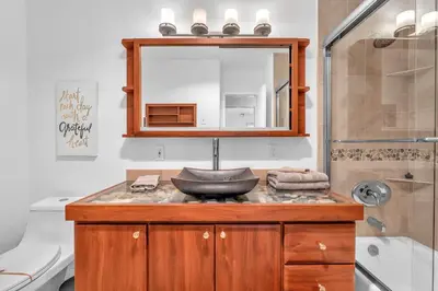 a bathroom with a sink and a mirror at Family Beach Home With Home Theater & Heated Pool! in Hollywood