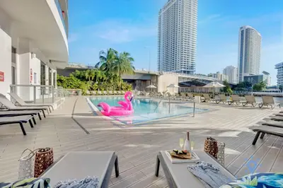 a pool with a pink flamingo in the middle of a building at Amazing Studio Beautifull View Balcony Pool Gym in Hallandale Beach