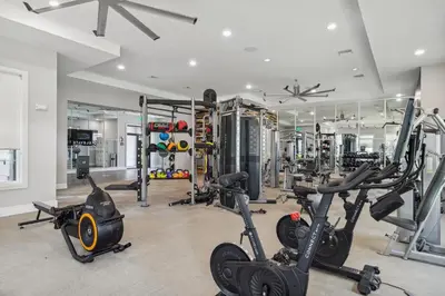 a gym with treadmills and exercise bikes in it at Kasa Hollywood Fort Lauderdale in Dania Beach
