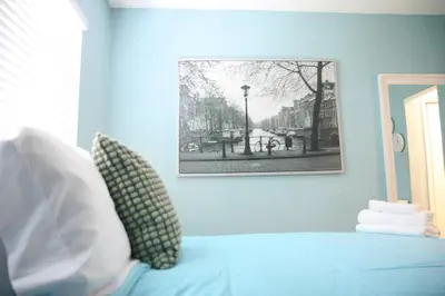 a blue bedroom with a picture on the wall at B03 Location! Studio close 2 Beach & Design District in Miami