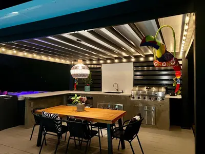 a kitchen with a wooden table and some chairs at Pura Vida Villa in Miami