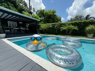a rubber duck in the middle of a swimming pool at Pura Vida Villa in Miami