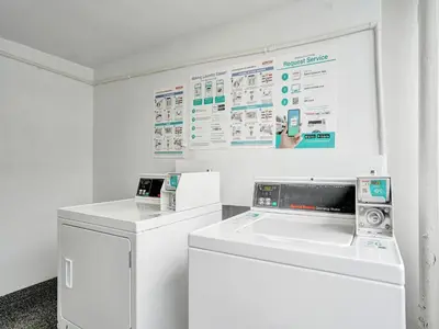 a white laundry room with a washer and dryer at Cozy Oceanfront Beach Service 917 in Miami Beach