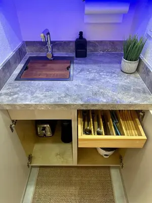 a kitchen counter with a sink and a counter top at Tropical Studio in Miami