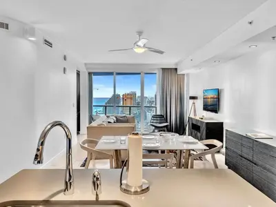 a kitchen and dining room with a view of a living room at FLL W Residence Penthouse, AMAZING birds eye views! in Fort Lauderdale