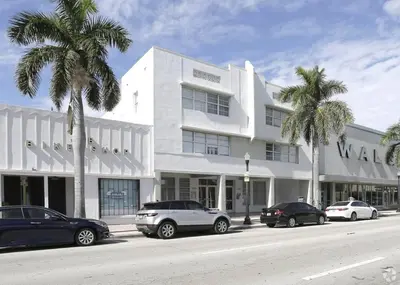 a white building with cars parked in front of it at 1Bedroom Collins 2 Blocks to Ocean with Paid Street Parking in Miami Beach