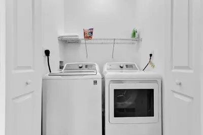 a kitchen with two refrigerators and a stove at Beautiful Apt 5min walking Design District apt 1 in Miami