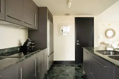 a kitchen with a sink and a counter top at Luxurious Stunning Views condo in Miami