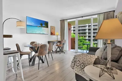 a living room with a couch and a table at Serene Cozy Retreat with Balcony Free Parking in Miami