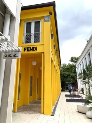 a yellow building with the word fend on it at B06 5 min from beach studio Midtown in Miami