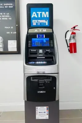 an atm machine sitting next to a wall at Comfy Apt 5 min walking to Design District apt 4 in Miami